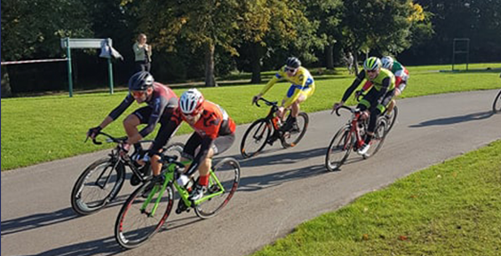 A group of six cyclists on the road