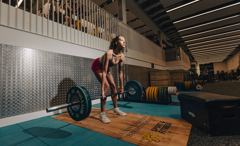Student weightlifting in the Sport & Fitness gym