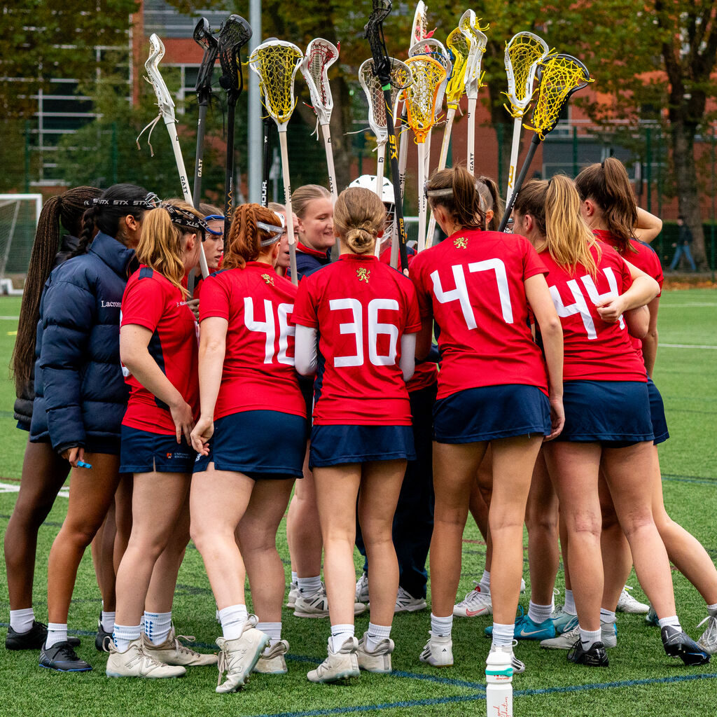 Lacrosse grouped together with sticks.