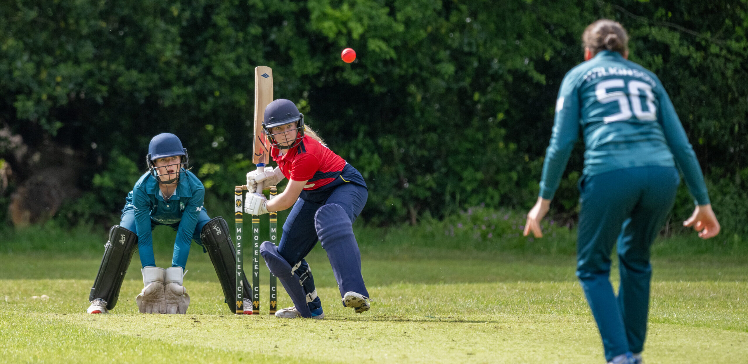 Women's Cricket - batting ball.