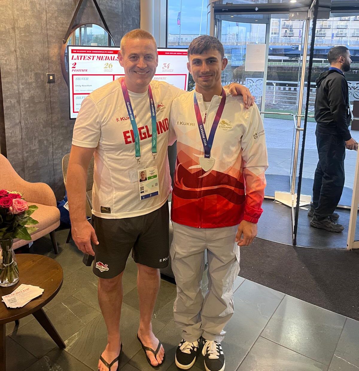 Ben Levy with his coach and medal at the Commonwealth Games.
