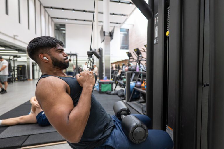Man using cable machine.
