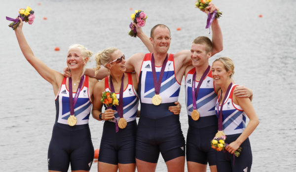 From (L to R) Britain's Pamela Relph, Naomi Riches, Davis Smith, James Roe and Lily van den Broecke celebrate on the podium after they win gold in the rowing LTA mixed coxed four during the London 2012 Paralympic Games.