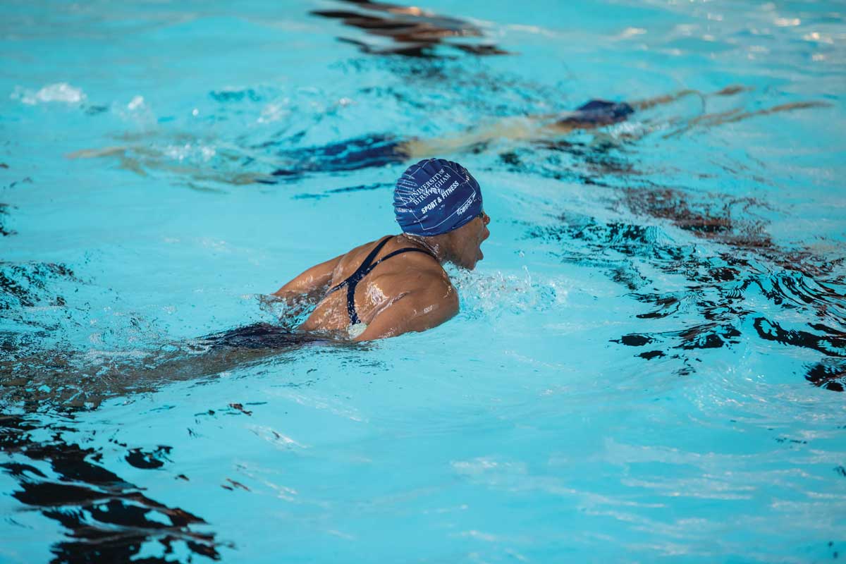 Female swimming in the pool