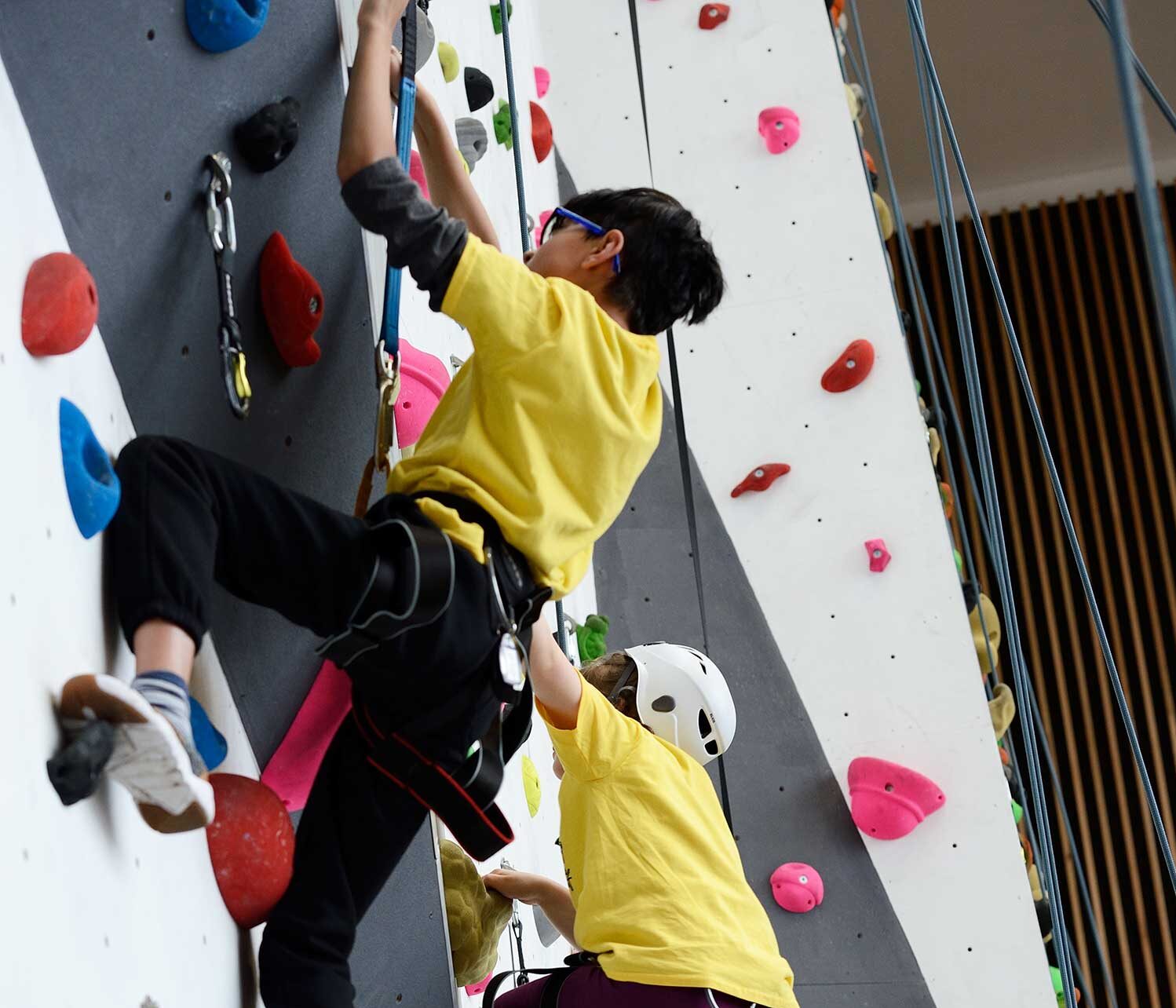 Junior climbing session with three juniors climbing the 10m climbing wall