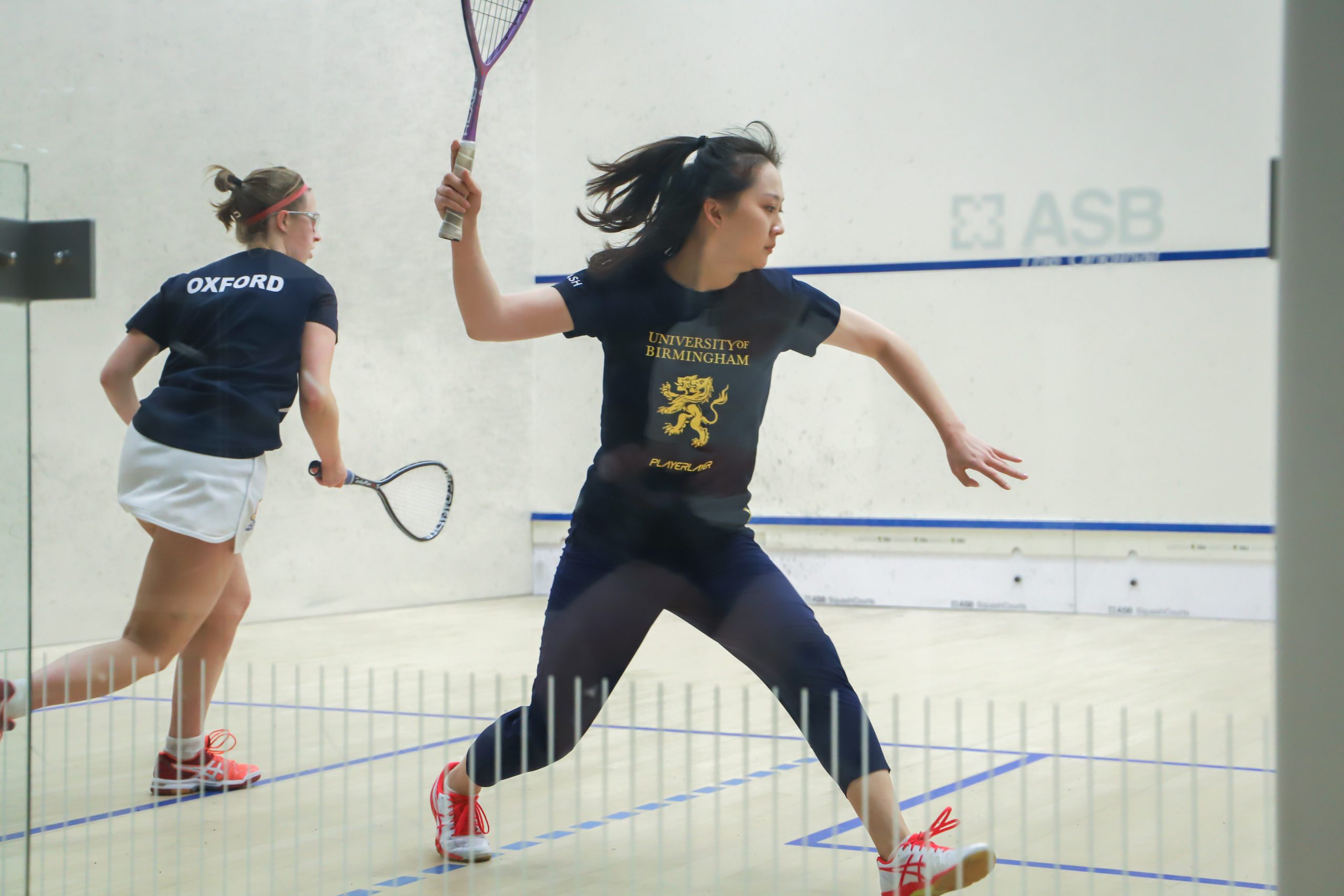 Squash players on court