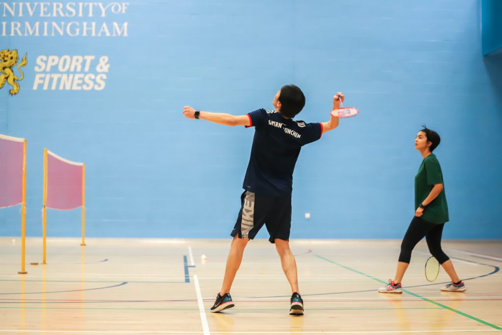 Man hitting shuttlecock