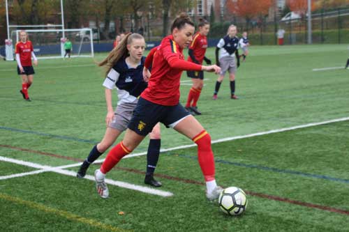 female dribbling with the ball