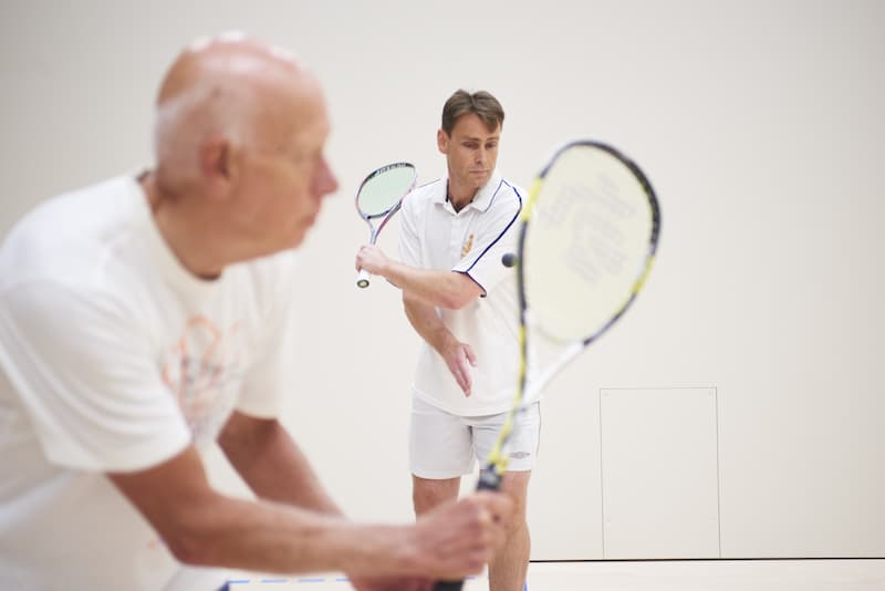 Two men playing squash