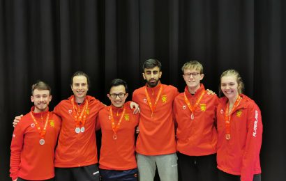 Six University of Birmingham athletes wearing their medals at the BUCS Karate Championship