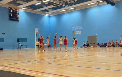 University of Birmingham netball player takes a shot during a game in the Munrow Arena