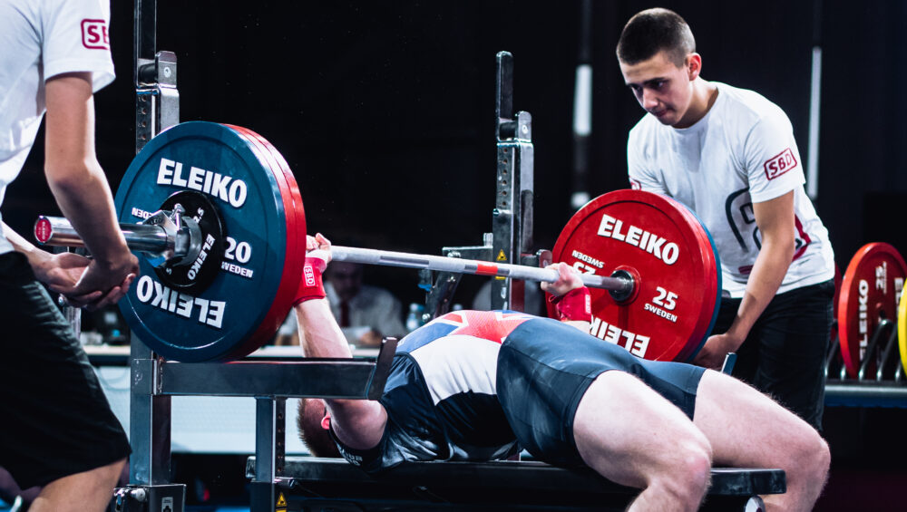 Image of Andrew Ward bench pressing at a championship