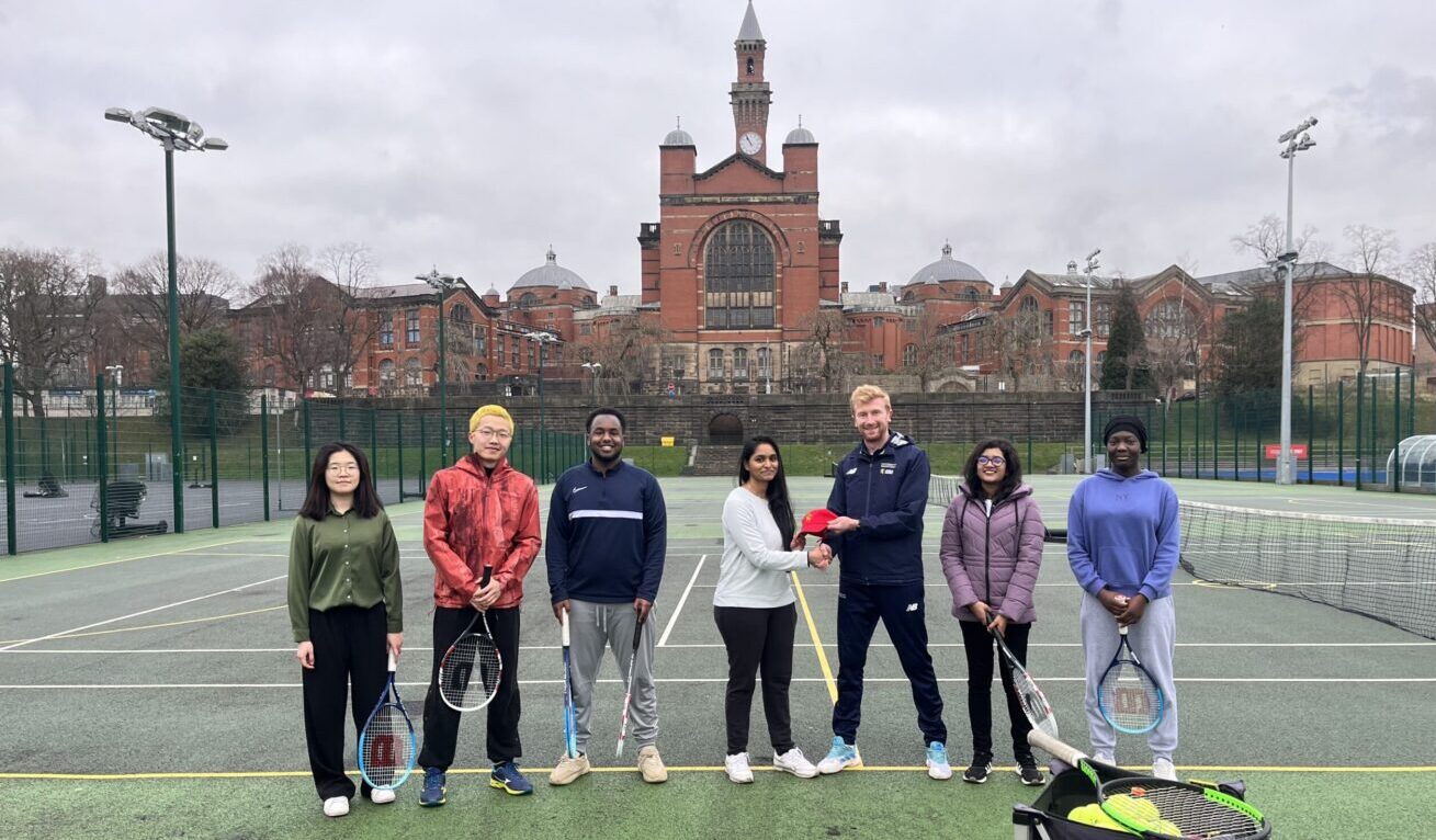 An image of Jack, Tennis Coordinator, with students taking part in the masterclass