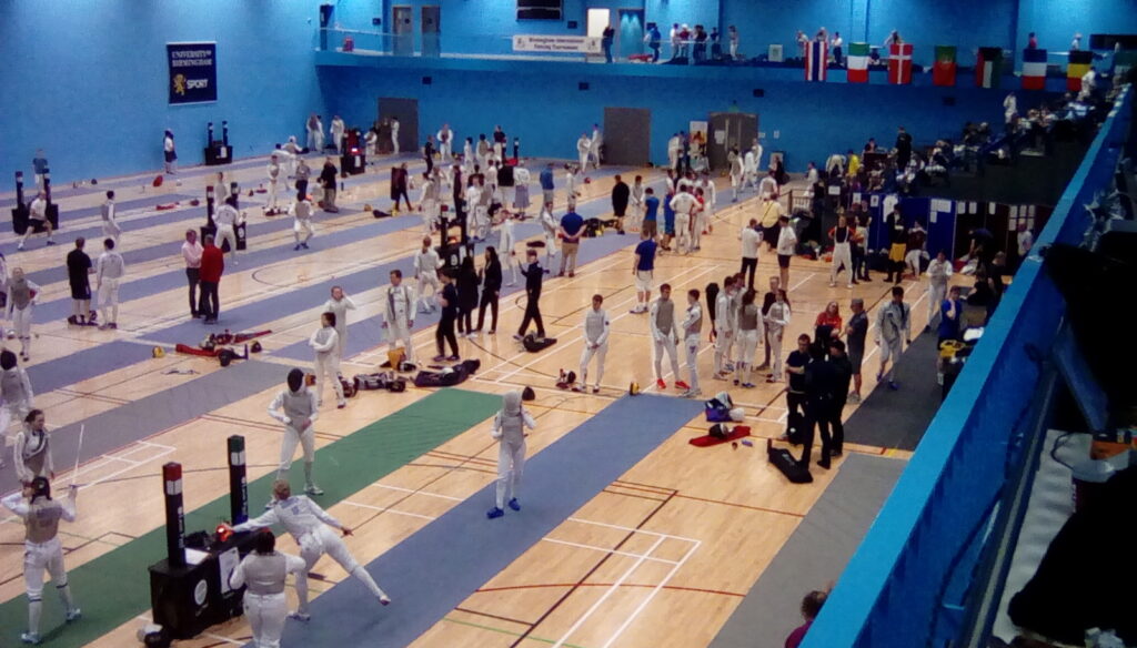 Lots of people taking part in fencing.
