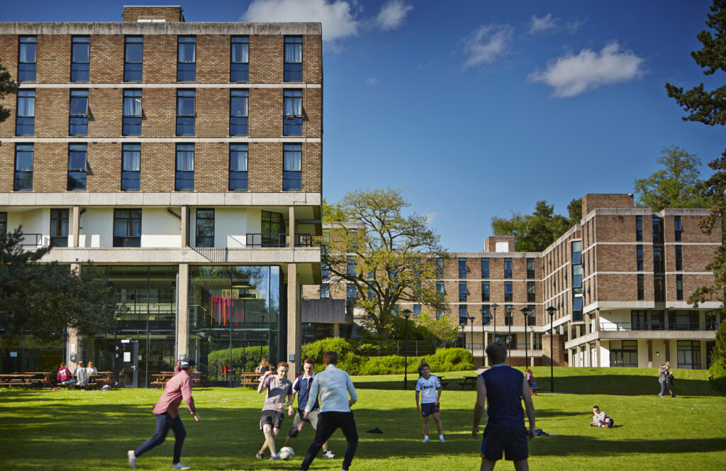Students playing football outside the Vale.