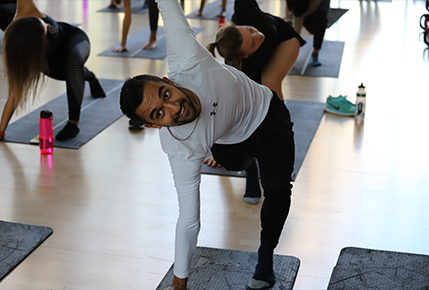 student exercising on yoga mat