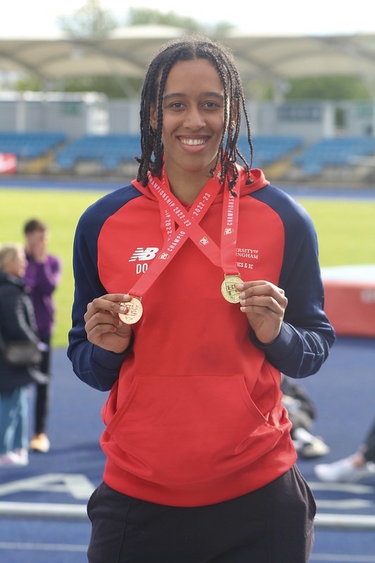 Didi Okoh with a bronze and gold medal