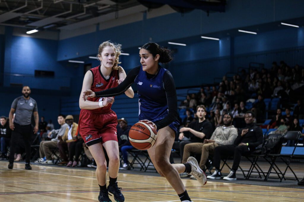 Rebellion 2023, woman running with ball