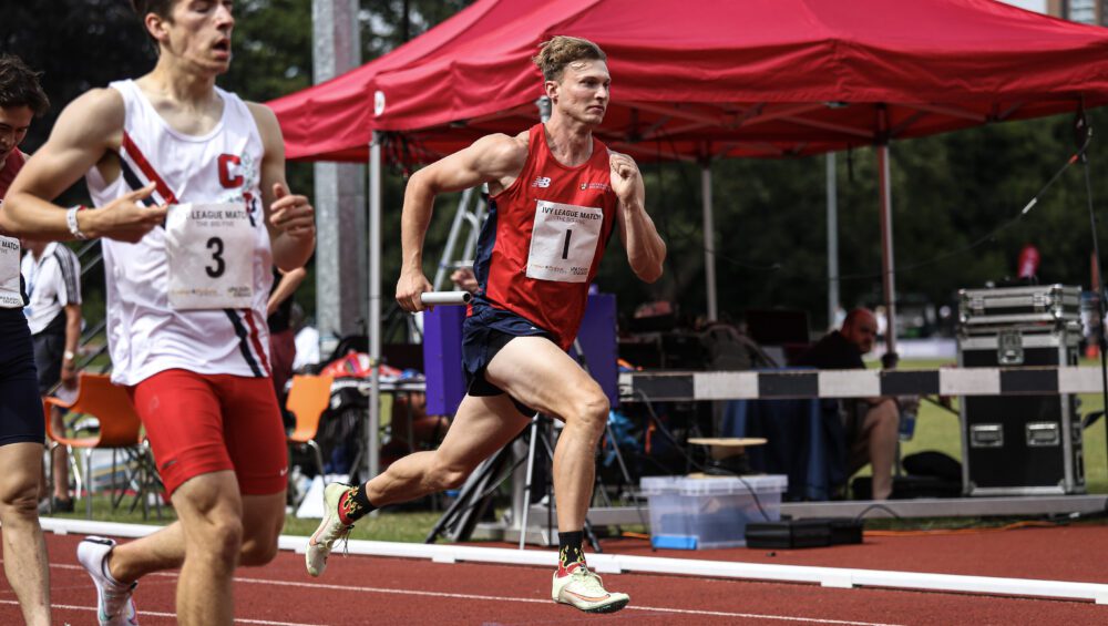 Picture of UOB athlete running alongside Ivy League competitor