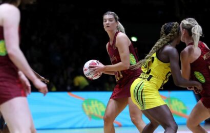 Fran playing Netball in Vitaly Roses Kit