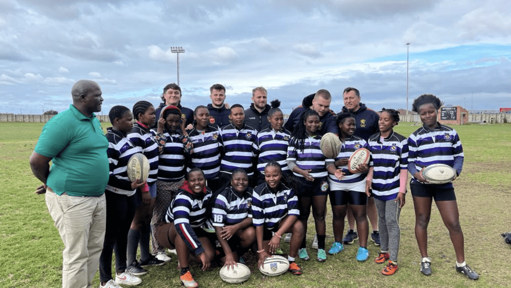 Local South African team with University of Birmingham Rugby Union smiling for group photo