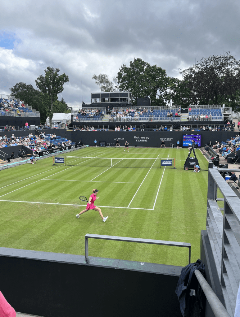spectator view of outdoor tennis court