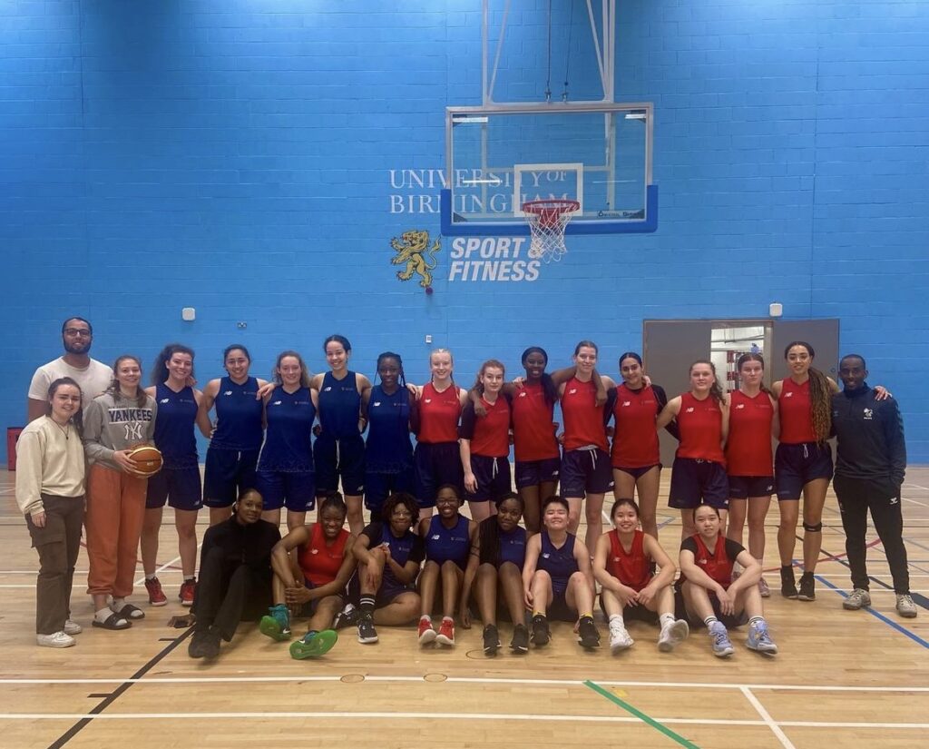 Womens social basketball group photograph underneath the basketball net in UoB Sport & Fitness