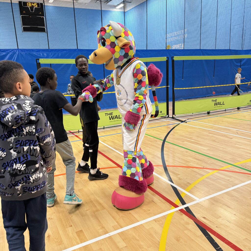 Mascot perry fist bumping children