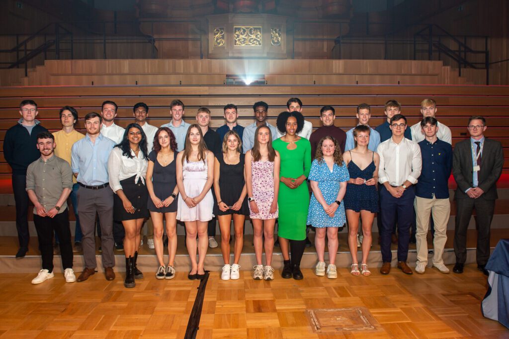 Group of students stood on stage at the Sports Awards.