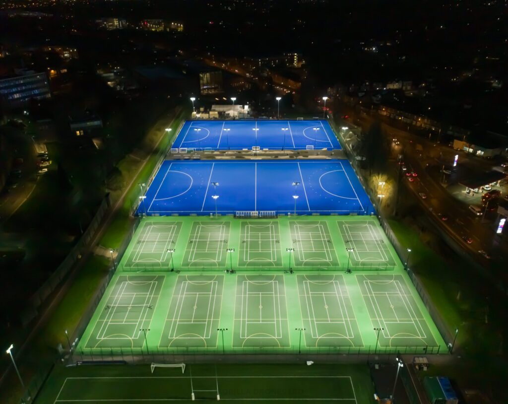 Wide shot of outdoor pitches at night (water based, tennis/netball and bournbrook 3G)