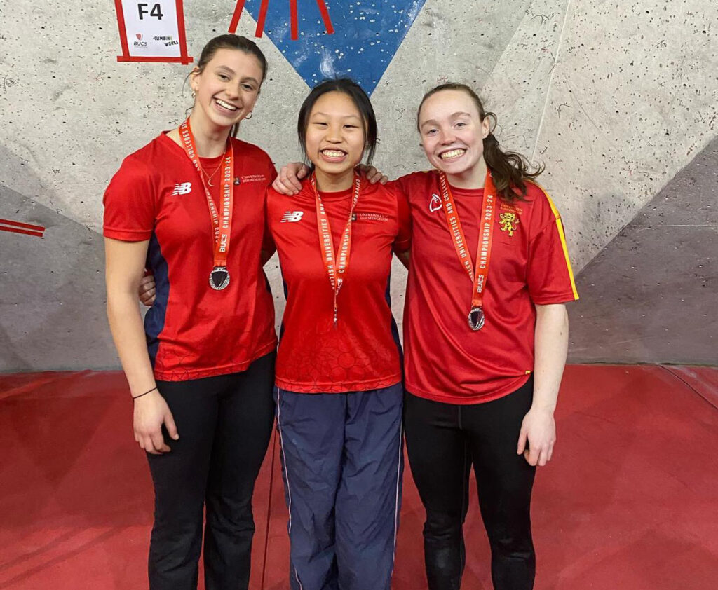 Women's climbing team all with BUCS medals around their neck.