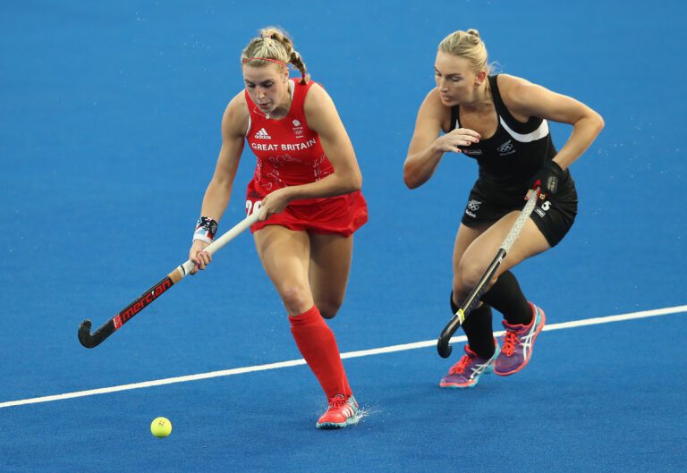 Lily Owsley of Great Britain breaks with the ball from Pippa Hayward during the Women's hockey semi final match betwen New Zealand and Great Britain on Day 12 of the Rio 2016 Olympic Games at the Olympic Hockey Centre on August 17, 2016 in Rio de Janeiro, Brazil. Photo by David Rogers/Getty Images.