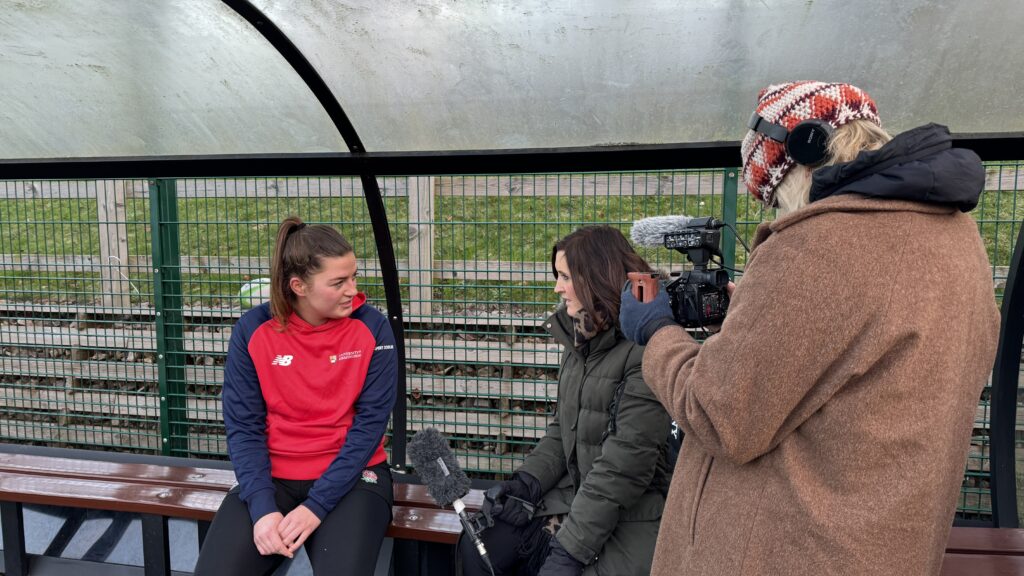 Member of women's rugby team sat on bench for interview with Katie Gornall