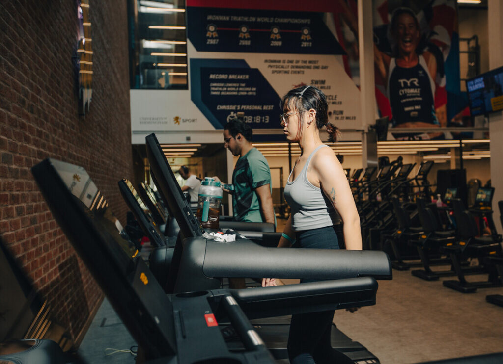 Two gym members walking on the treadmill at Sport & Fitness.