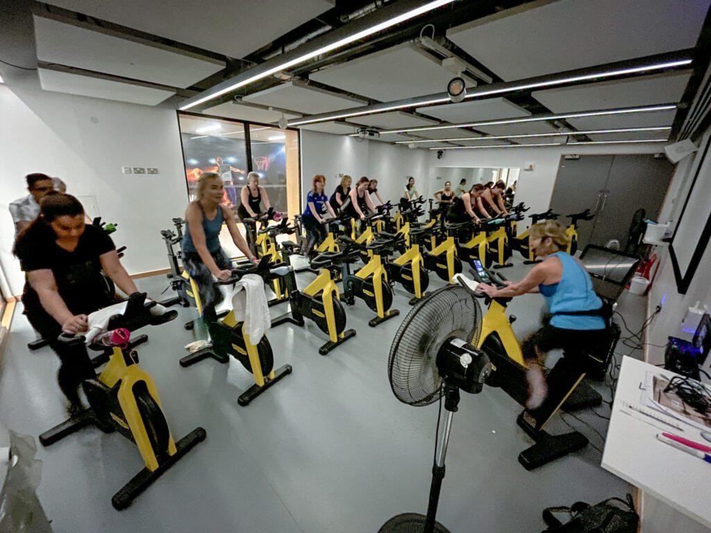 Group in a spin class in cycle studio