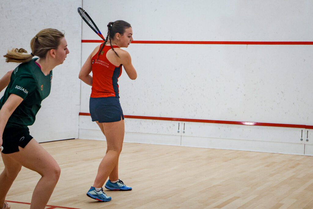 Women's Squash players in the court