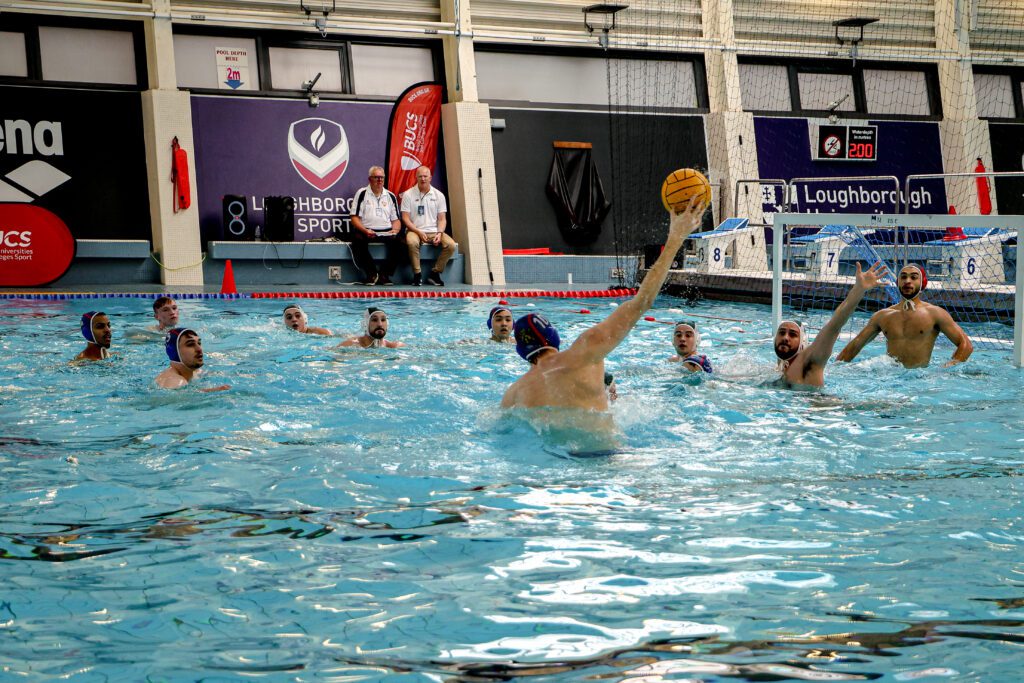 Men's Water Polo competing in swimming pool