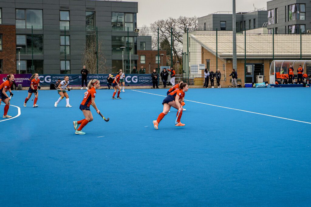 Women's Hockey competing on the pitch