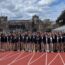 sixty students athletes from Ivy League Exchange posing on the athletics track