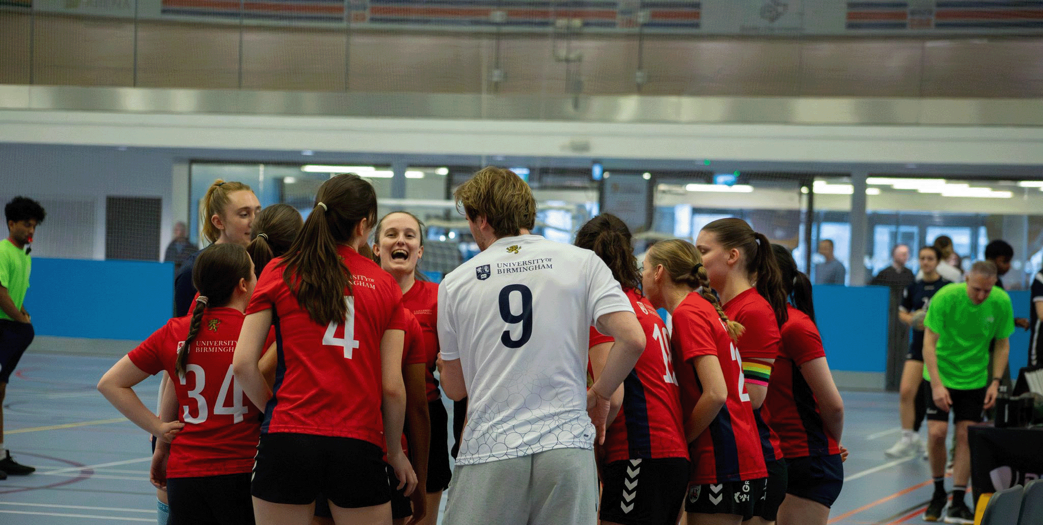 Group shot of the team in a huddle.