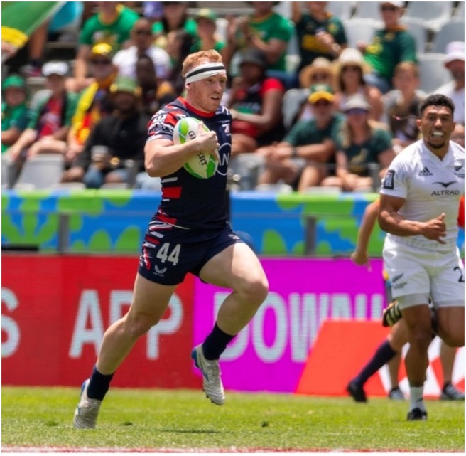 Sunni Jardin running with Rugby ball on field