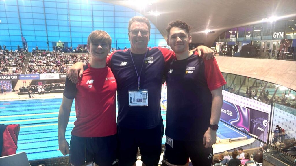 Gary Humpage with 2 swimmers
