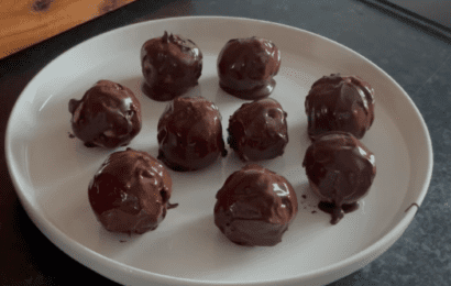 Brown chocolate protein balls on a plate