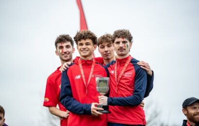 Athletics students holding trophy
