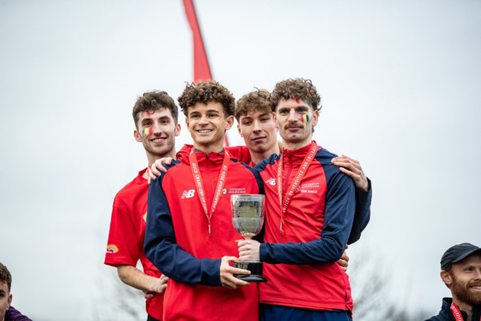 Athletics students holding trophy
