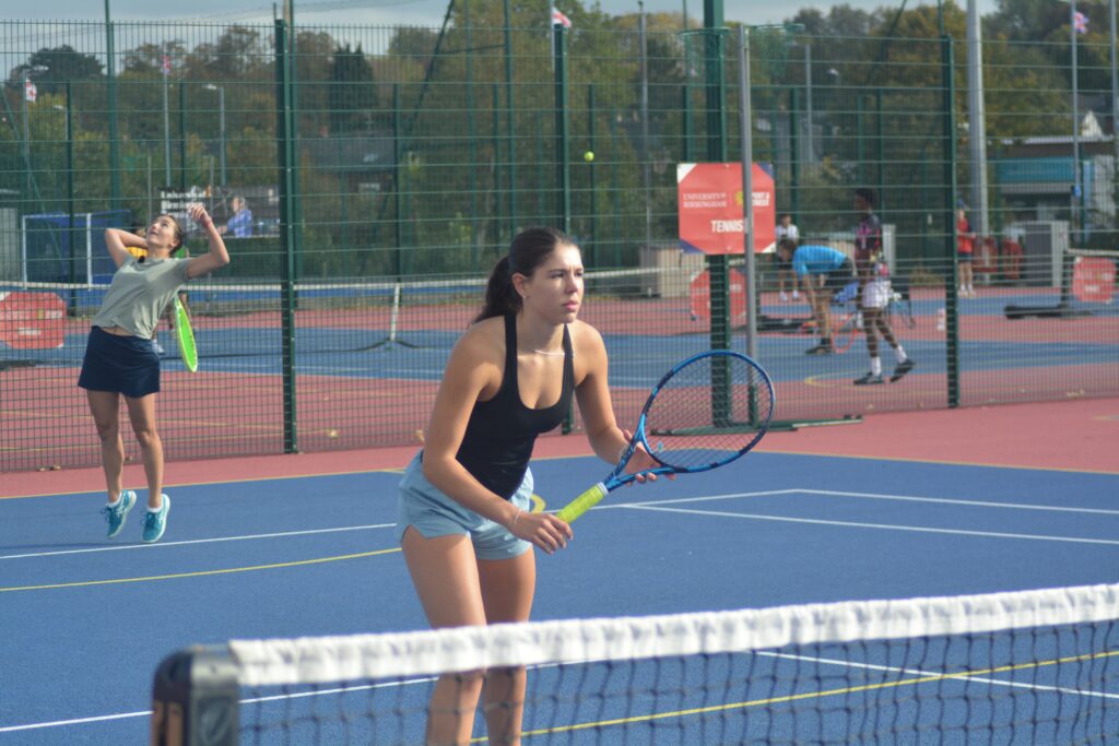Tennis player waiting to return a shot on tennis courts on Edgbaston campus