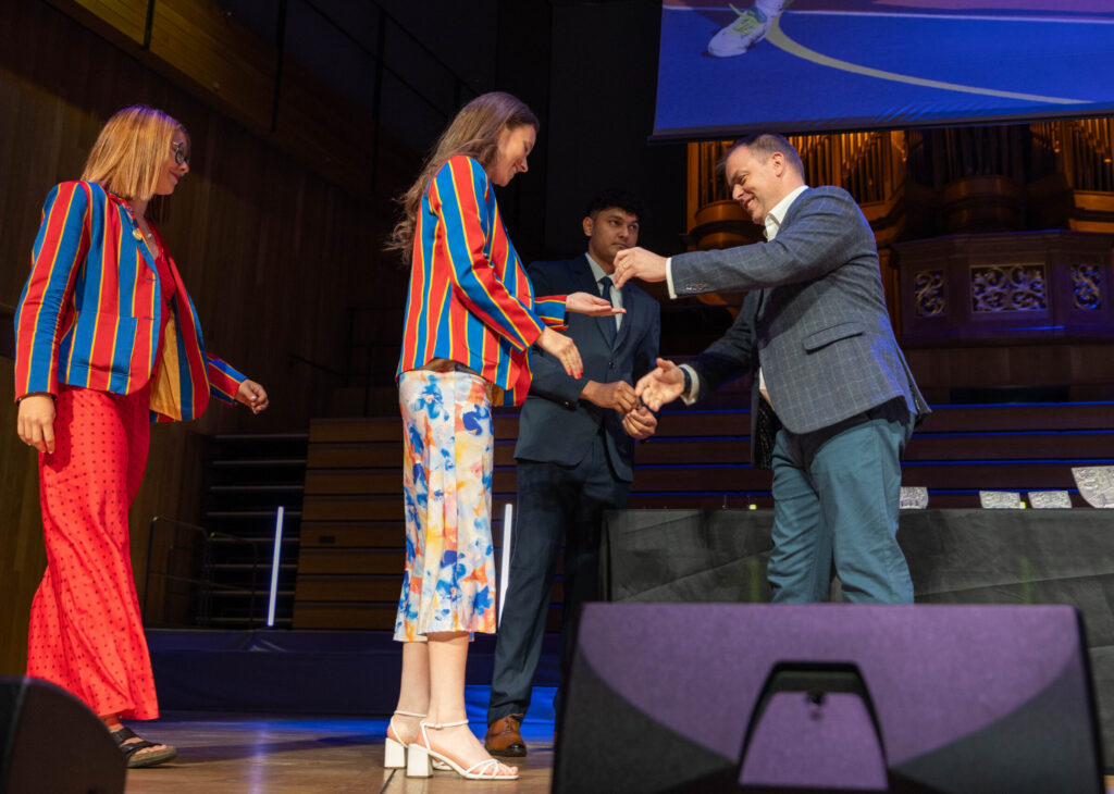 Half Blues and Full Blues collecting their awards from Ian Pollock.