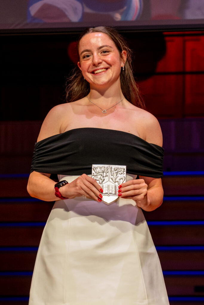 Caitlin Costello collecting her Volunteer of the Year award at the UoB Sports Awards.