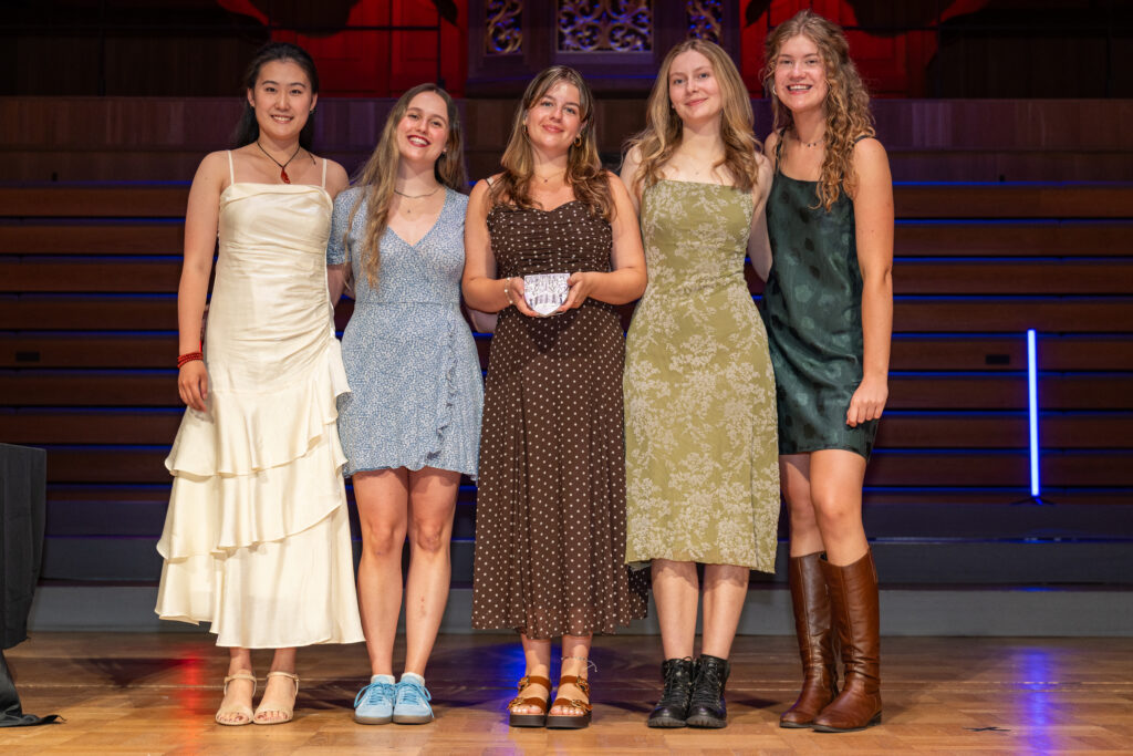 Women's Volleyball collecting their Regional Team of the Year award at the UoB Sports Awards.