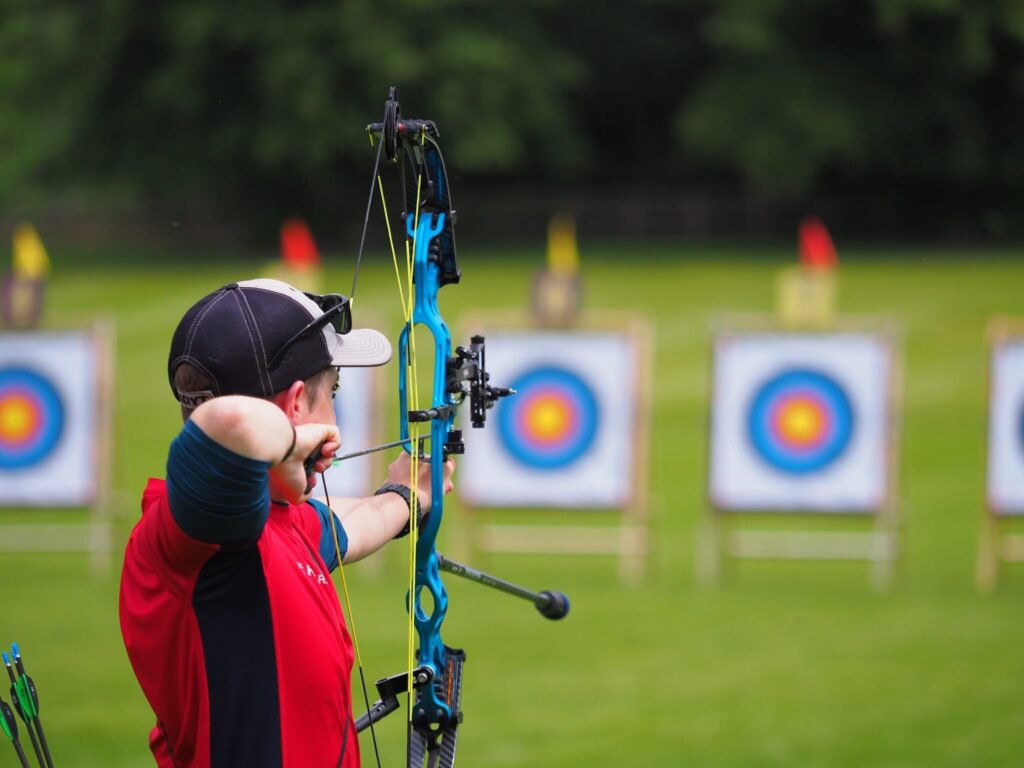 Man shooting an arrow at a target.